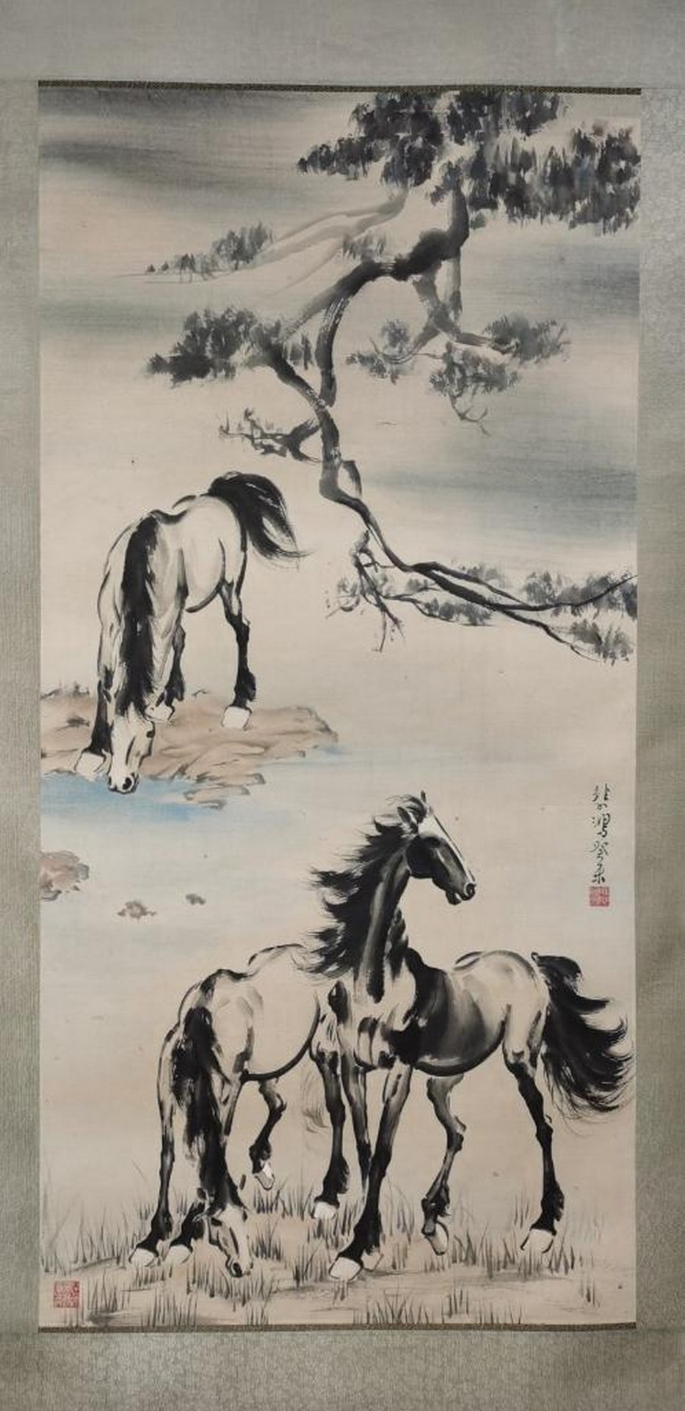 Graceful Horses Inspired Painting by Xu Beihong: Graceful Horses Inspired Painting by Xu Beihong This dynamic handpainted paper artwork, inspired by the expressive realism of Xu Beihong, features three horses in a tranquil natural setting. With flui
