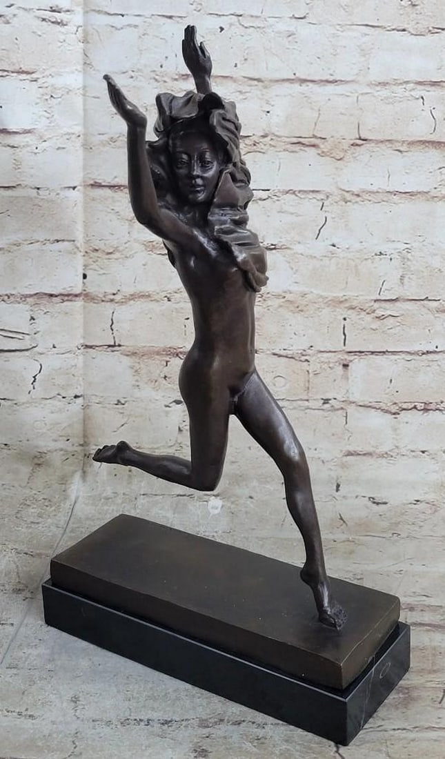 Leap of Freedom Bronze Sculpture: Leap of Freedom Bronze Sculpture This powerful bronze sculpture captures a moment of pure exhilaration as a nude woman leaps gracefully into the air. The artist, Jean Patoue, masterfully conveys the f