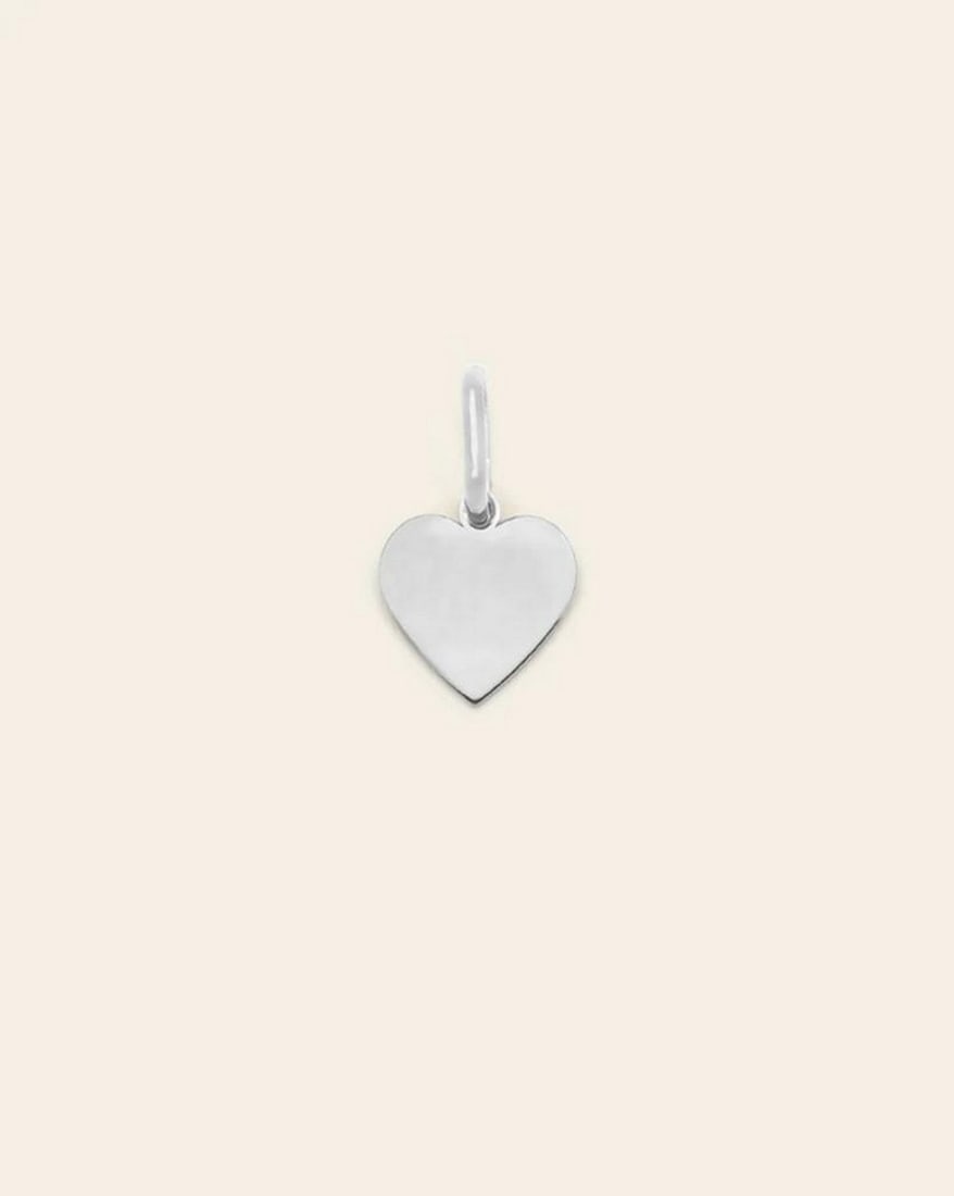 Sterling Silver Heart Charm Pendant: Sterling Silver Heart Charm Pendant This Sterling Silver Heart Charm Pendant is a timeless symbol of love and elegance. Crafted from polished sterling silver, its delicate heart-shaped design exudes