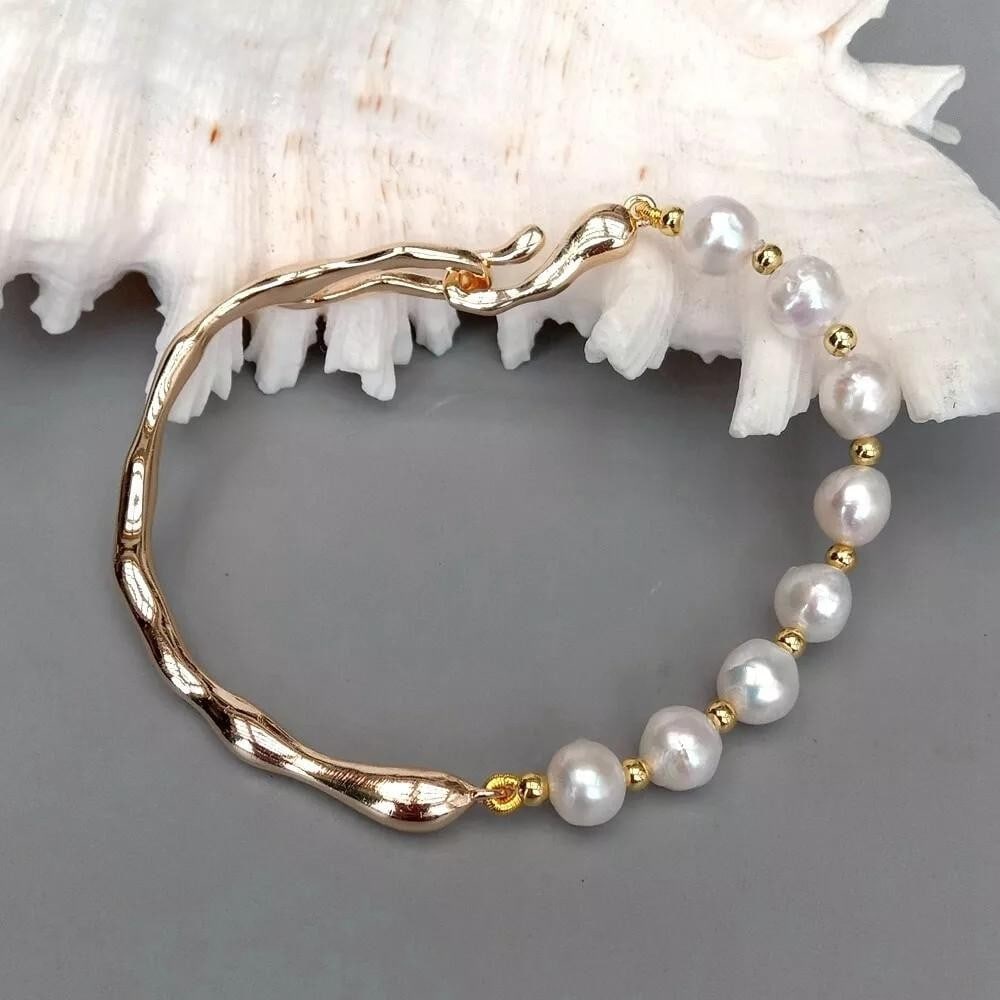 Gold-Plated Bangle Bracelet with Cultured White Pearls: Gold-Plated Bangle Bracelet with Cultured White Pearls This stunning gold-plated bangle bracelet features lustrous cultured white pearls that radiate elegance and sophistication. The classic design ef