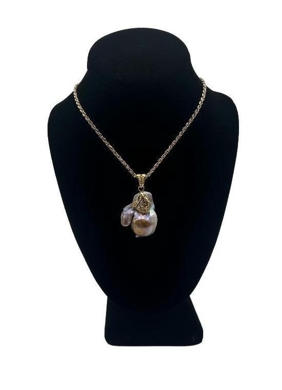 Lavender Keshi Pearl With Leaves Necklace: Lavender Keshi Pearl With Leaves Necklace The keshi pearl pendant featured in this necklace is approximately 22mm x 38mm. It has hold plated leaves with cubic zirconias on the front and a gold plated 