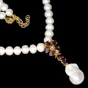 17.5'' Pear Shape Rhodolite Garnet & Freshwater Pearl Necklace: 17.5" Pear Shape Rhodolite Garnet & Freshwater Pearl Necklace. Centering The Elegant Strand Of Fresh Water Pearls Is A Medallion Of 14GP Pendant With Set Pear Shaped Rhodolite Garnets Stones In A R