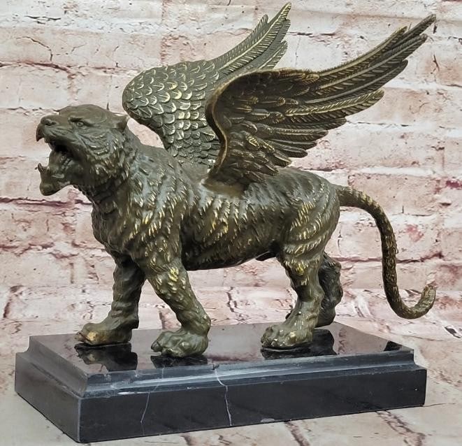 Majestic Griffin Bronze Sculpture: Majestic Griffin Bronze Sculpture This Majestic Griffin Bronze Sculpture brings to life the legendary guardian of ancient myth, a powerful creature with the body and head of a lion and wings of an eag