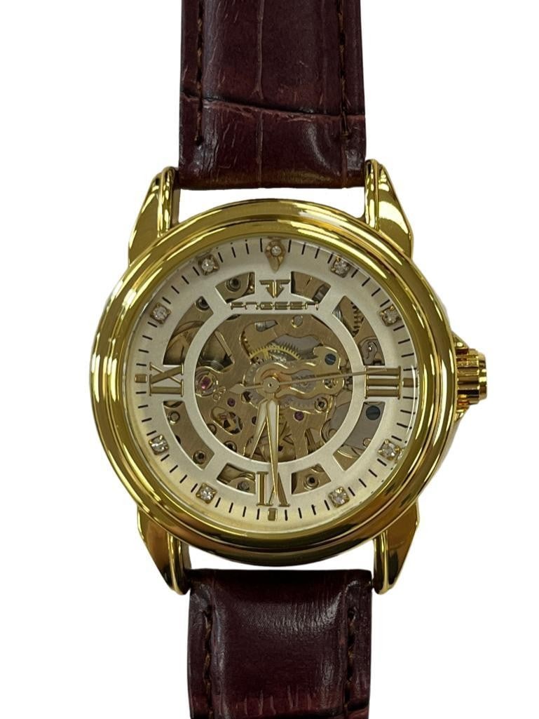 Mens Sophisticated Gold Automatic Skeleton Watch With Brown Genuine Leather Band: Mens Sophisticated Gold Automatic Skeleton Watch With Brown Genuine Leather Band Introducing the Mens Sophisticated Gold Automatic Skeleton Watch With Brown Genuine Leather Band-a timepiece that exude