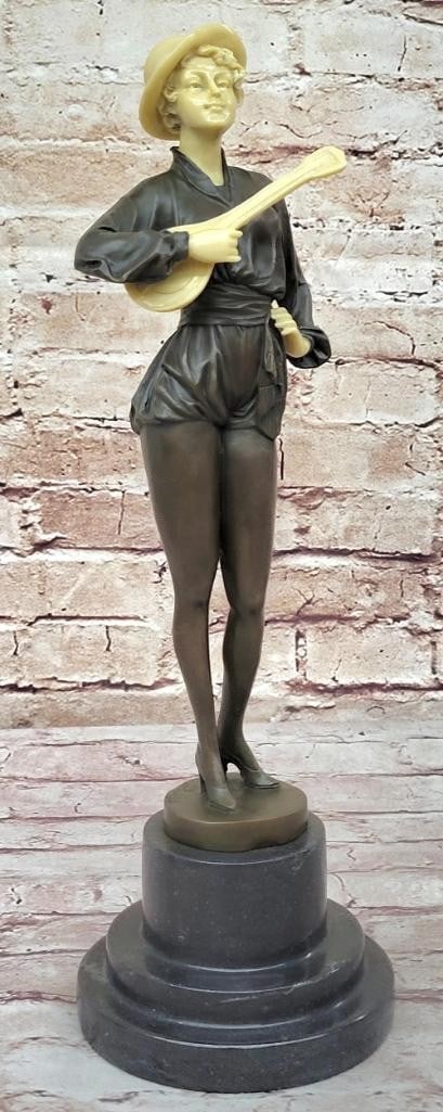 Mandolin Guitar Player Inspired Bronze Statue - 16'' x 5'': Mandolin Guitar Player Inspired Bronze Statue - 16" x 5" This elegant woman rests a small guitar against her chest, holding it in one arm, while her other hand is placed confidently on her hip. 