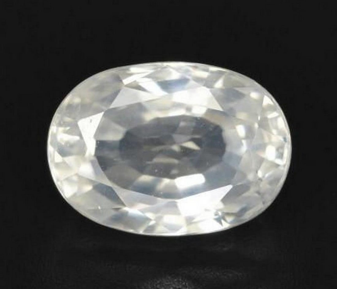 3.2ct Oval Cut Faceted Shiny Warm White Zircon Gemstone: 3.2ct Oval Cut Faceted Shiny Warm White Zircon Gemstone Type: Zircon Weight: 3.20 ct 1 gem Size: 9 x 6.4 x 4.6 mm Exact Size: 9.00 x 6.44 x 4.56 mm Shape: Oval Facet Color: Warm White Clarity: VVS Tre