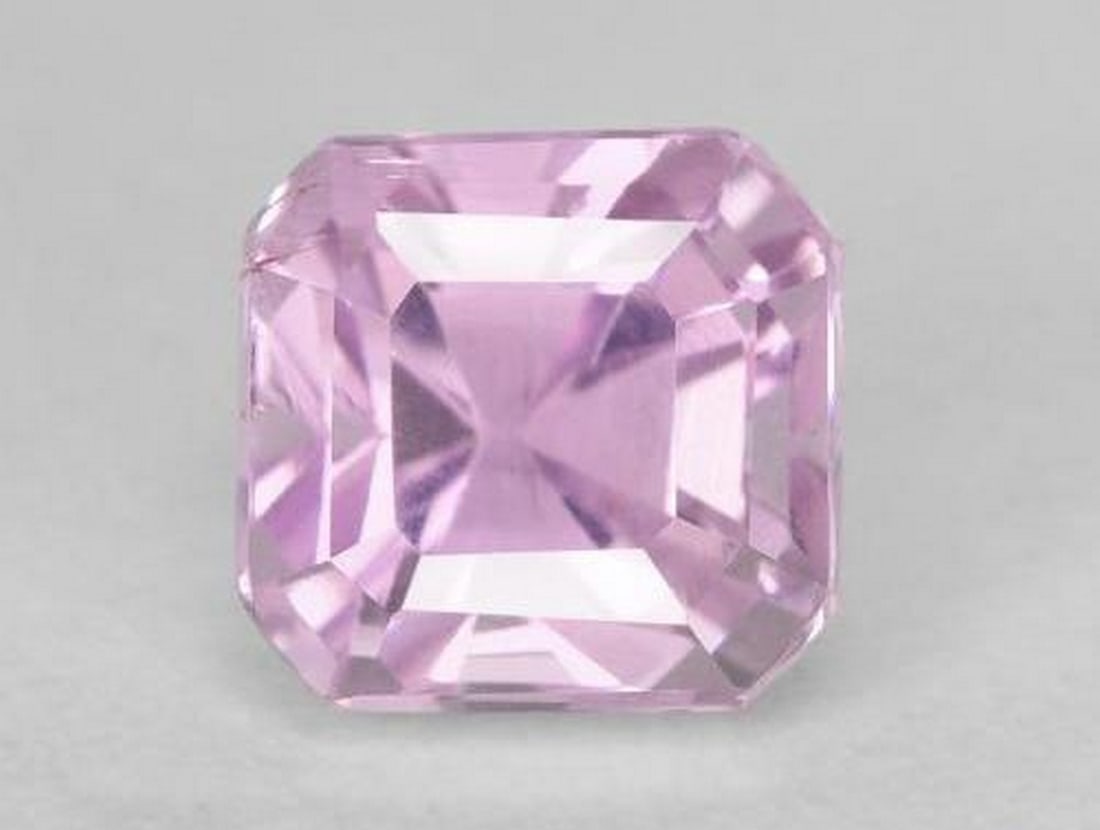 2.10ct Octagon Step Cut Medium Purple Kunzite: 2.10ct Octagon Step Cut Medium Purple Kunzite A beautiful medium purple kunzite weighing 2.10 ct, expertly fashioned in an elegant octagon step cut that enhances its clarity and soft violet hues. With