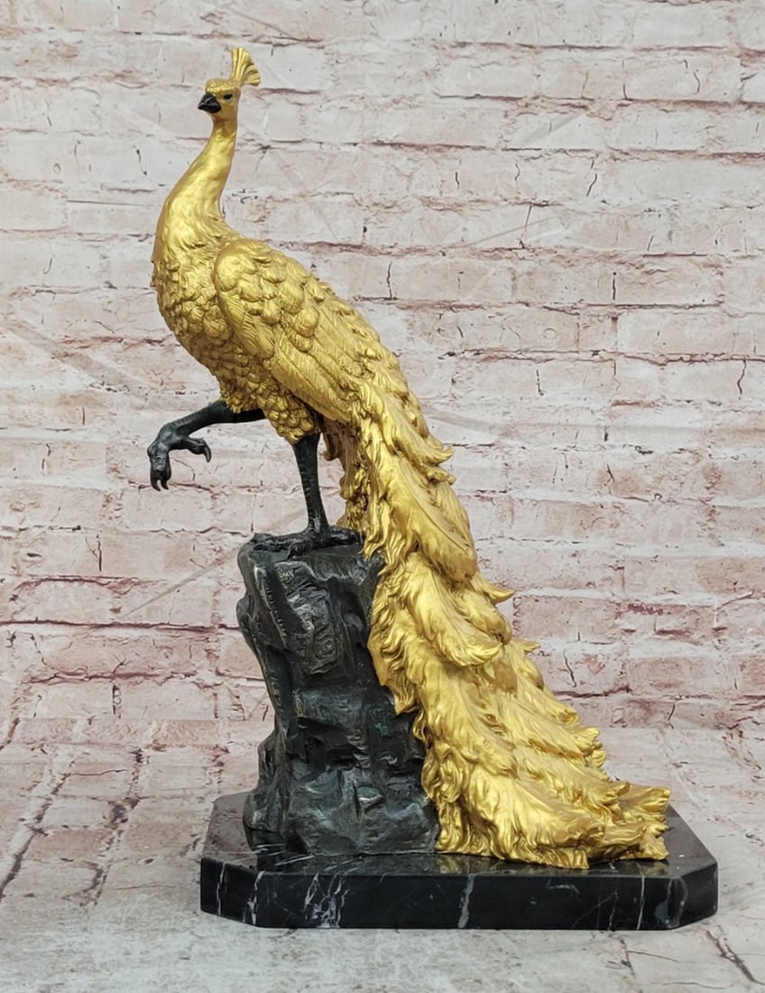 Golden Peacock Bronze Sculpture on Marble Base - 19.5" x 12": Golden Peacock Bronze Sculpture on Marble Base - 19.5" x 12" This original bronze sculpture features a majestic peacock displayed in an elegant, regal stance, symbolizing beauty, pride, and pr
