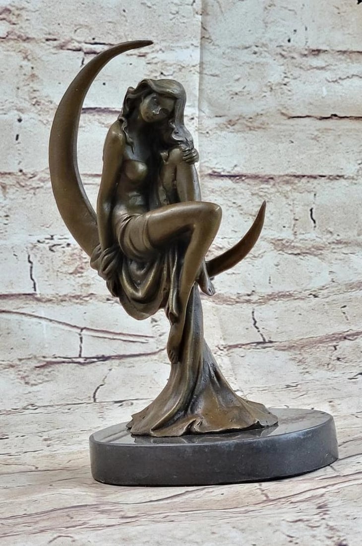 Women Sitting on Crescent Moon Inspired Bronze Statue - 9" x 5.5": Women Sitting on Crescent Moon Inspired Bronze Statue - 9" x 5.5" This stunning bronze sculpture captures a woman in a moment of intense passion, crafted with intricate detail. Seated upright 