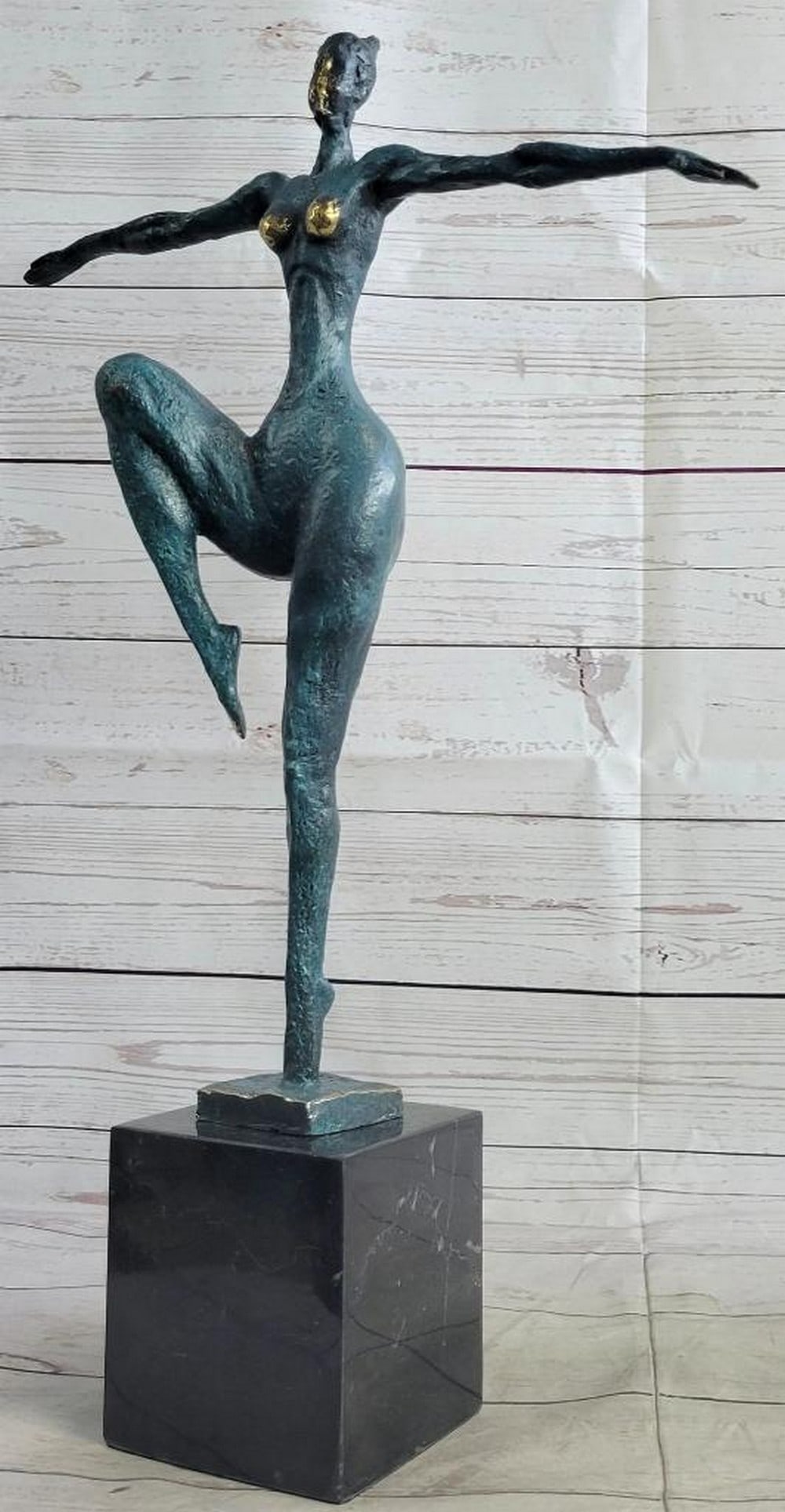 Contemporary Female Nude Dancer Bronze Sculpture - 22" x 14": Contemporary Female Nude Dancer Bronze Sculpture - 22" x 14" An abstract female dancer sculpture. You can just tell this is a powerful dancer in the sharpness of her position. This wonderfully