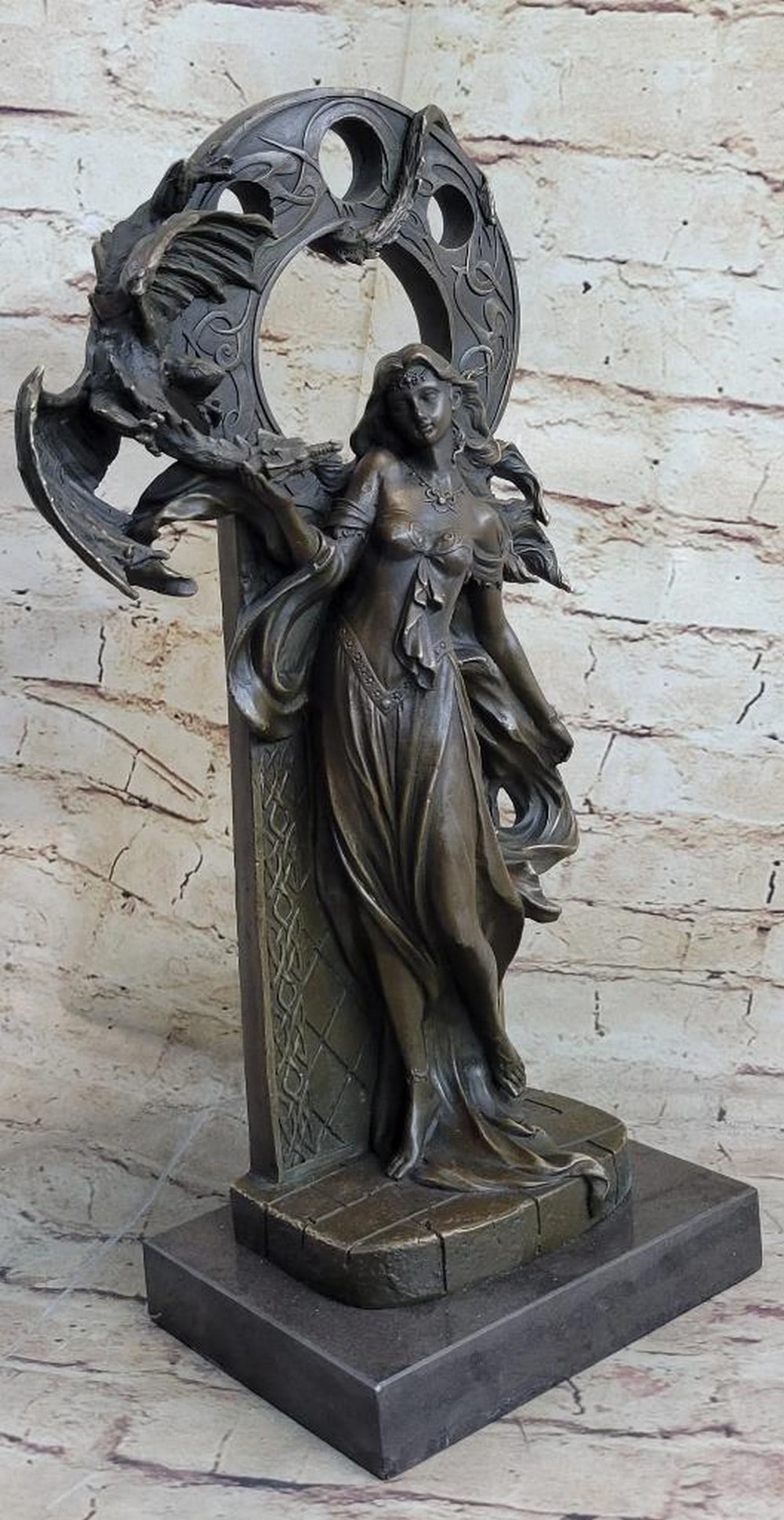 Bronze Dragon Guardian Sculpture by Jean Patoue - 16" x 8": Bronze Dragon Guardian Sculpture by Jean Patoue - 16" x 8" The Bronze Dragon Guardian Sculpture captures the powerful balance of strength and beauty in stunning detail. An alluring woman stand