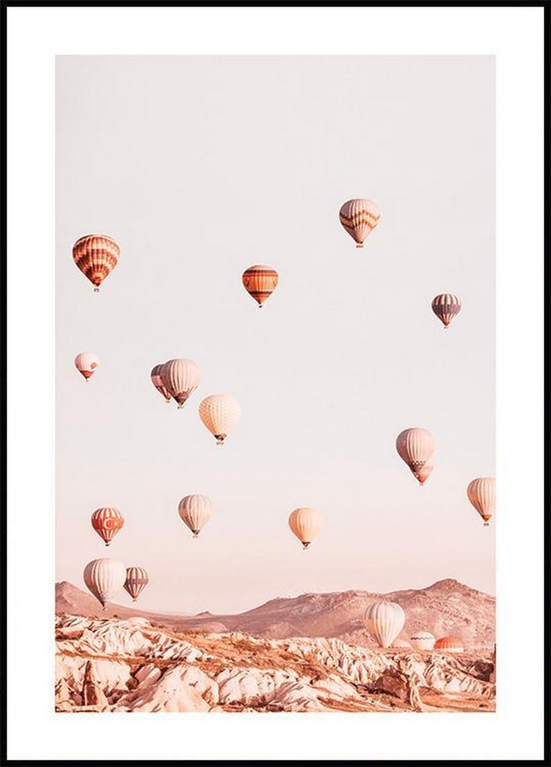 Hot Air Balloons Poster: Hot Air Balloons Poster Photo art poster in soft pastel tones with a dreamy motif of colourful hot air balloons which drift freely over pointy mountain tops towards the light blue sky. The poster has 