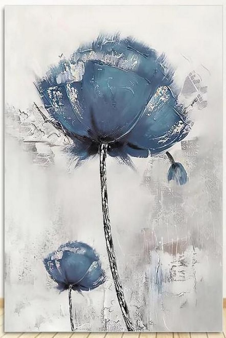 Blue Blossoms Picture: Blue Blossoms Picture. This image captures the serene beauty of two vibrant blue flowers. The rich, calming shades of blue bring an air of tranquility, while the flowers' delicate petals seem to whisp
