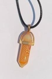 White & Orange Crystal Pendant Necklace: White & Orange Crystal Pendant Necklace This stunning crystal pendant necklace features a harmonious blend of pure white and vibrant orange hues, creating a striking contrast that catches the eye. Cra