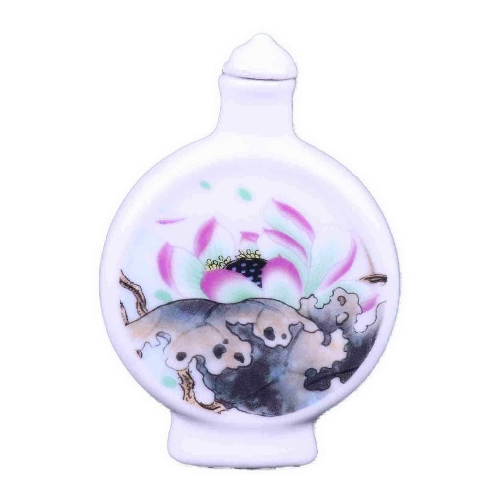 Hand Painted Chinese Snuff Bottle w Lotus Design: Hand Painted Chinese Snuff Bottle w Lotus Design This exquisite snuff bottle features hand-painted lotus flowers on a translucent white background. Delicate shades of pink and green create a captivati