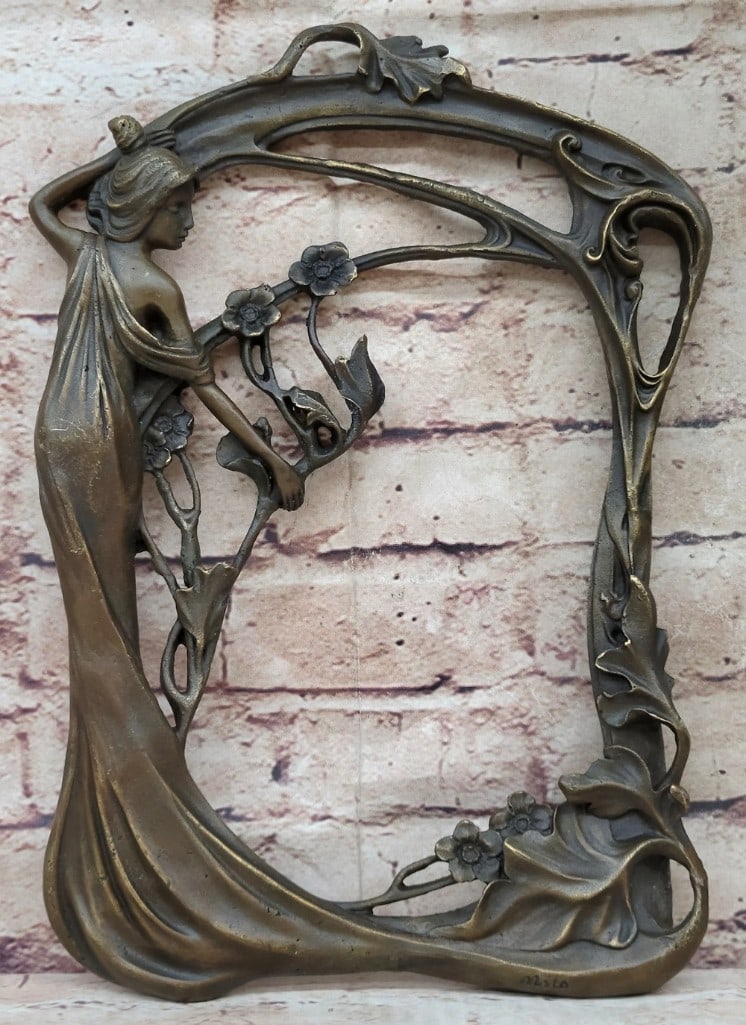 Bronze Bas-Relief Sculpture of Woman with Flower, Milo Signature - 11.5'' x 8'': Bronze Bas-Relief Sculpture of Woman with Flower, Milo Signature - 11.5" x 8" This bronze bas-relief sculpture depicts a woman holding a flower, designed for wall mounting. The piece features de