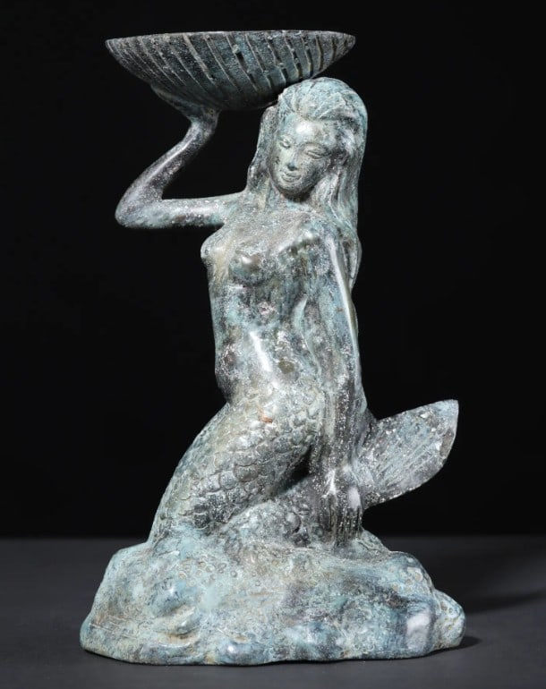 Brass Mermaid with Tealight Holder - 8'': Brass Mermaid with Tealight Holder - 8" An 8-inch brass statue of a mermaid crafted using the lost wax technique. The figure features detailed incised lines across her scaled body, flowing hair, an