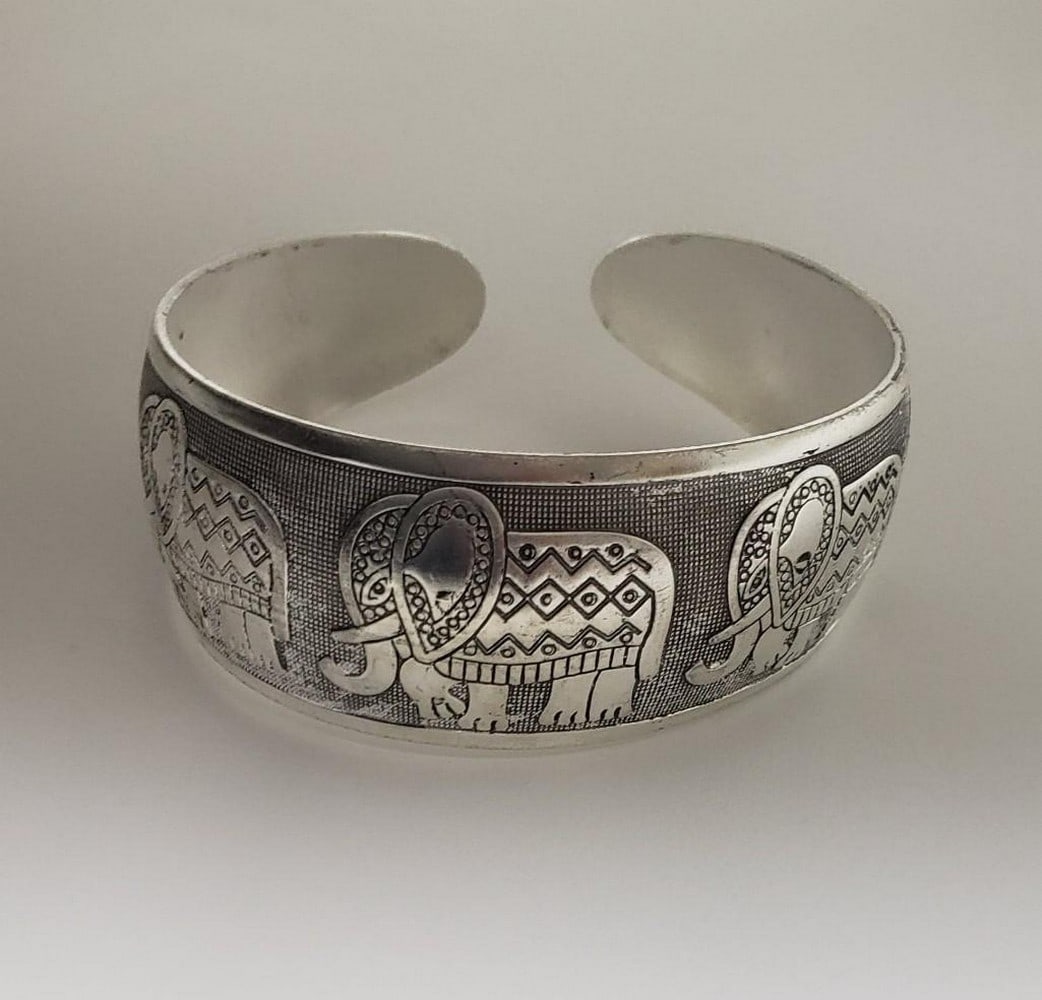 Tibetan Silver Ladies Bangle: A Tibetan Silver Ladies Bangle Decorated In Tribal Elephants. View Photos For Further Details.