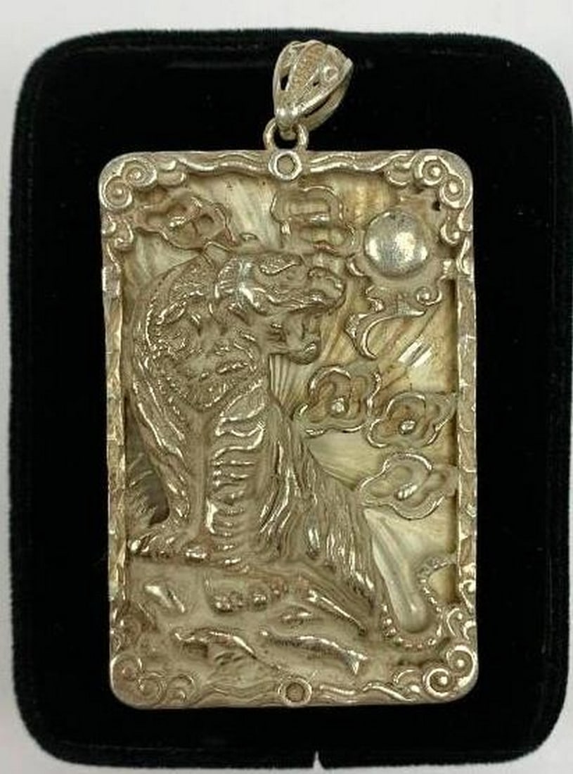 Chinese Tibetan Silver Feng Shui Tiger Pendant: Chinese Tibetan Silver Feng Shui Tiger Pendant. This pendant is a beautifully handcrafted piece featuring intricate detailing. It symbolizes strength, protection, and courage. This auspicious pendant 