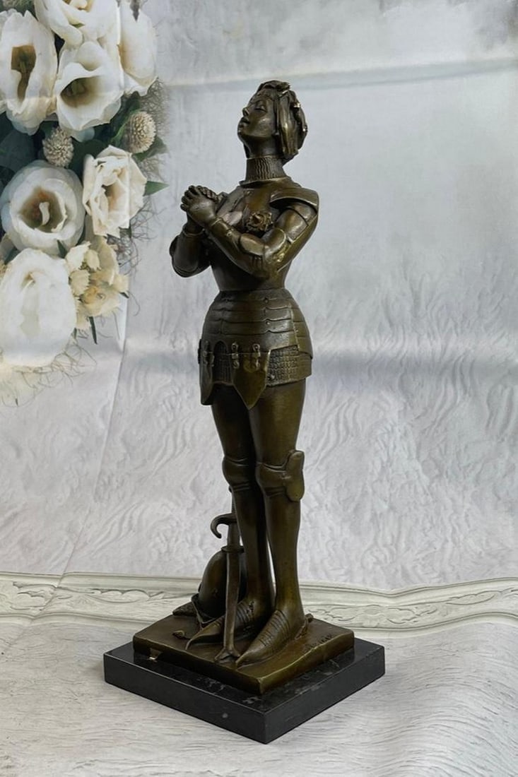 Joan of Arc Roman Catholic Saint Praying Bronze Sculpture: Joan of Arc Roman Catholic Saint Praying Bronze Sculpture She was France`s national heroine and a saint to Catholics. Her story of triumph is both inspiring and tragic. Saint Joan of Arc or The Ma