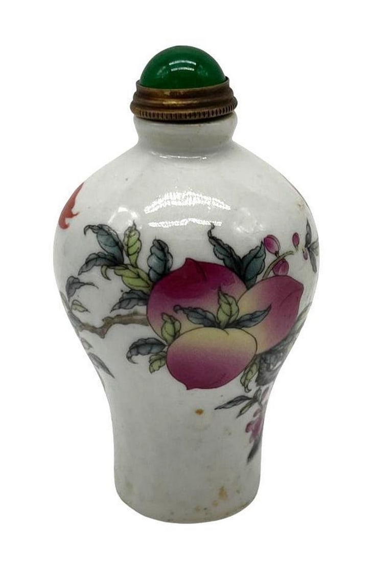 Lush Chinese Porcelain And Jade Snuff Bottle: Lush Chinese Porcelain And Jade Snuff Bottle Carefully handmade Chinese porcelain and jade snuff bottle. Reign signed on the bottom. View photos for further details.