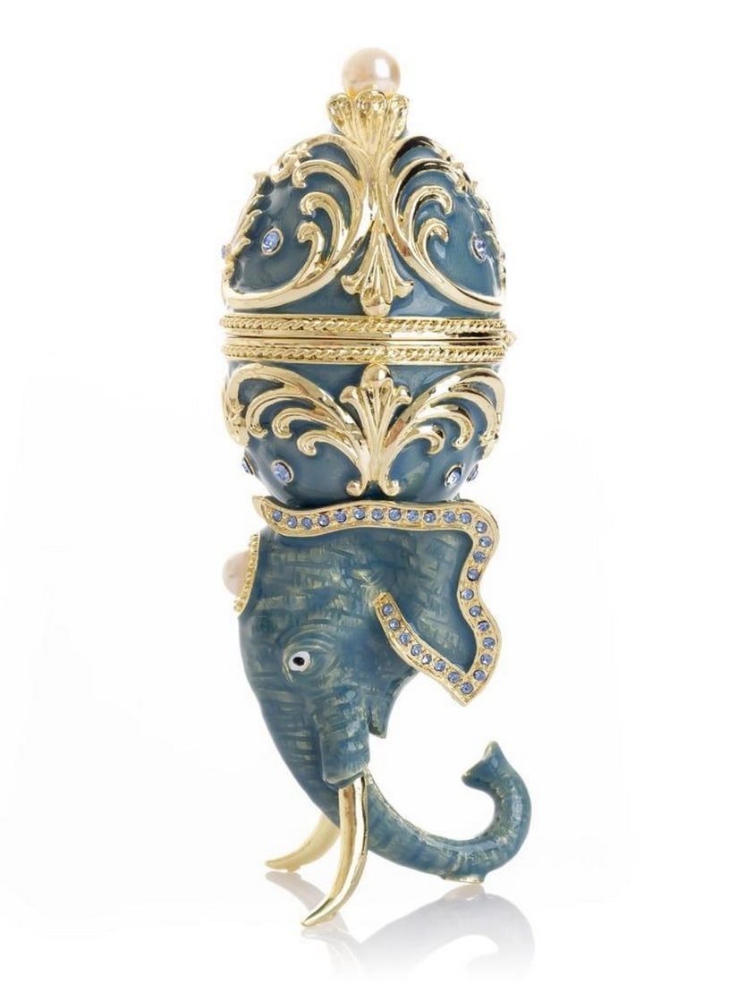 Unique Easter Egg Elephant Pedestal: Unique Easter Egg Elephant Pedestal This enamel trinket box, hand-painted and adorned with Austrian crystals, is finished with 24K gold plating and features a secure magnetic closure. Each crystal is 