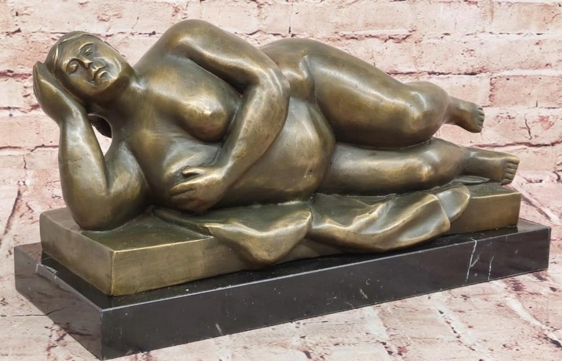 Reclining Beauty Bronze Sculpture: Reclining Beauty Bronze Sculpture Celebrate the timeless elegance of the human form with this striking reproduction bronze sculpture of a reclining nude woman, inspired by the renowned style of artist