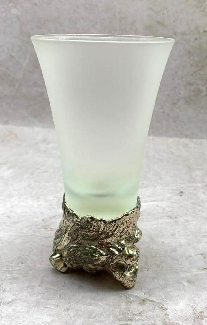 Frosted Glass with Metal Bear Head Base: Frosted Glass with Metal Bear Head Base Elevate your drinkware collection with this unique frosted glass, featuring a striking metal base adorned with the sculpted head of a bear. The textured frosted