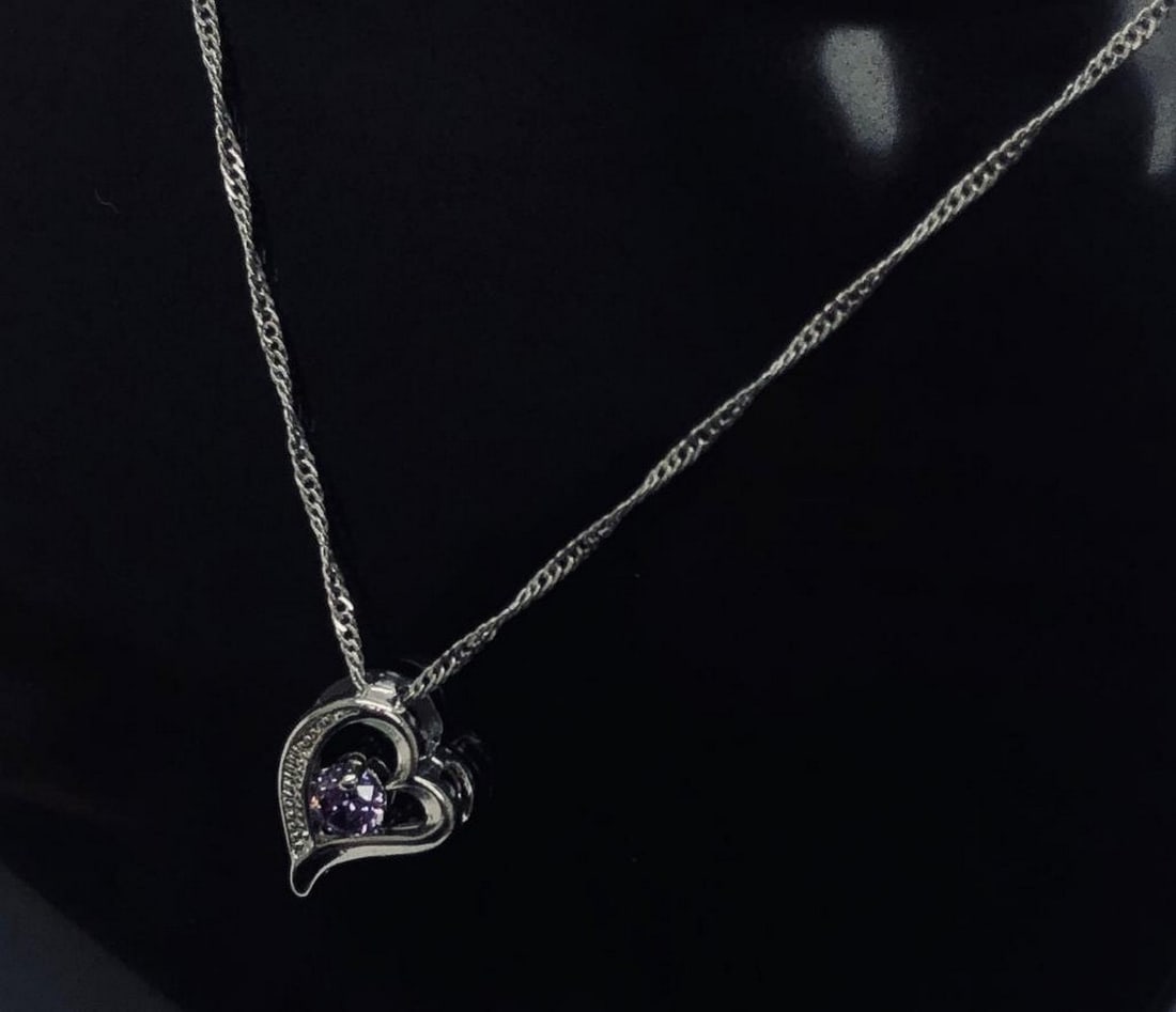 Sterling Silver Purple Rhinestone Heart Pendant Paired With 925 Twist Link Necklace: Sterling Silver Purple Rhinestone Heart Pendant Paired With 925 Twist Link Necklace. This Delicate And Beautiful Twist Link Necklace Allows The Pretty Heart-Shaped Pendant To Gracefully Stand Out. The