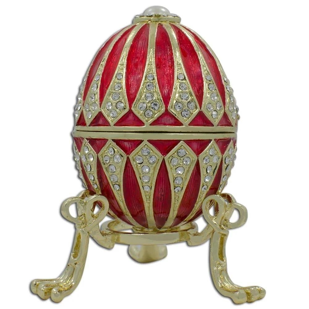 Regal Red Enamel Jeweled Imperial Easter Egg: Regal Red Enamel Jeweled Imperial Easter Egg Crafted from pewter, this stunning egg is embellished with clear crystals and a glossy enamel finish accented by golden trim. It opens smoothly on a hinge 
