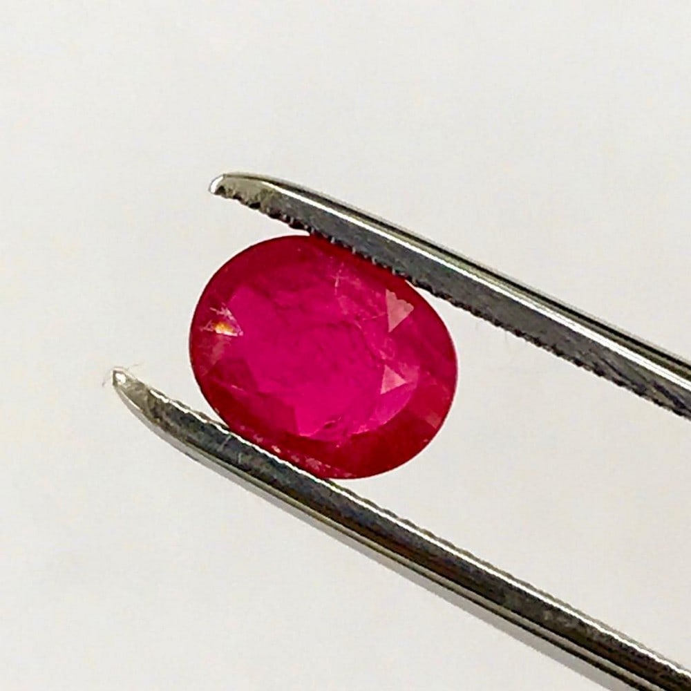 0.96ct Faceted Oval Ruby Gemstone: Faceted Oval Ruby Rubies are often associated with wealth and prosperity. Many ancient crowns were decorated with rubies, because they represented good fortune and courage. The rubys deep red color al