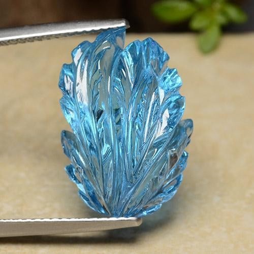 17.01ct Carved Leaf Topaz: 17.01ct Carved Leaf Topaz This unique, hand carved blue topaz leaf is stunning and would make for a beautiful daily wear jewelry. This is traditional August Birthstone. Dimensions 18.6 x 13.1mm Weight