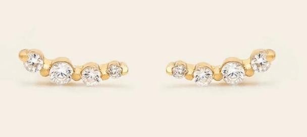 Sunrise Ear Climbers: Sunrise Ear Climbers Delicate ear climbers designed to follow the natural curve of the ear, adding subtle sparkle whether you have multiple piercings or wear them solo. Crafted in 14k gold vermeil