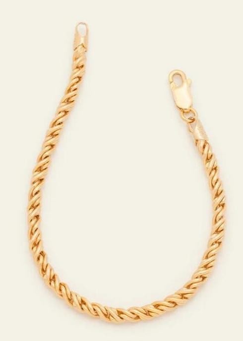 Golden Weave Bracelet: Golden Weave Bracelet A bold, high-shine bracelet featuring interwoven links for a substantial, luxe feel. Crafted in 14k gold vermeil, this piece is designed to make a statement on its own or