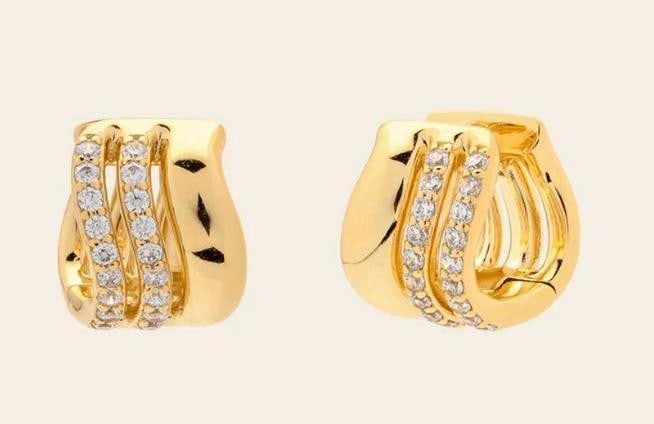 Luminous Trio Huggies: Luminous Trio Huggies Your ear stack's overachiever, these huggies bring polished shine with pave CZ detailing that catches the light beautifully. Crafted in 14k gold vermeil, the Luminous Trio