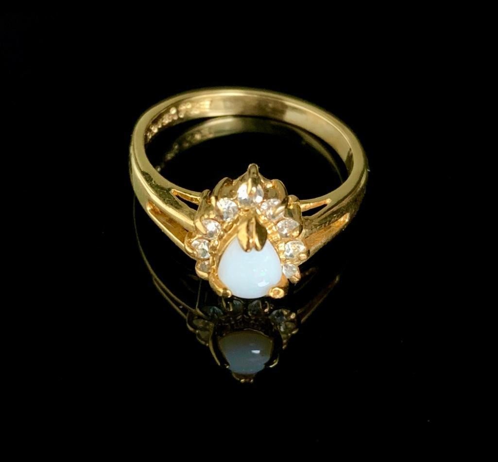Size 9 .20ct Pear Cut White Opal in 18K Gold Plated Ring: Size 9 .20ct Pear Cut White Opal in 18K Gold Plated Ring. Please view photos for further details. 