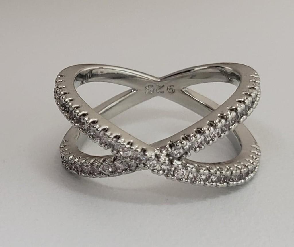 Sterling Silver 925 CZ Rhinestone Crossband Ring: Sterling Silver 925 CZ Rhinestone Crossband Ring. Ladies Size 7. Please View Photos For Further Details.