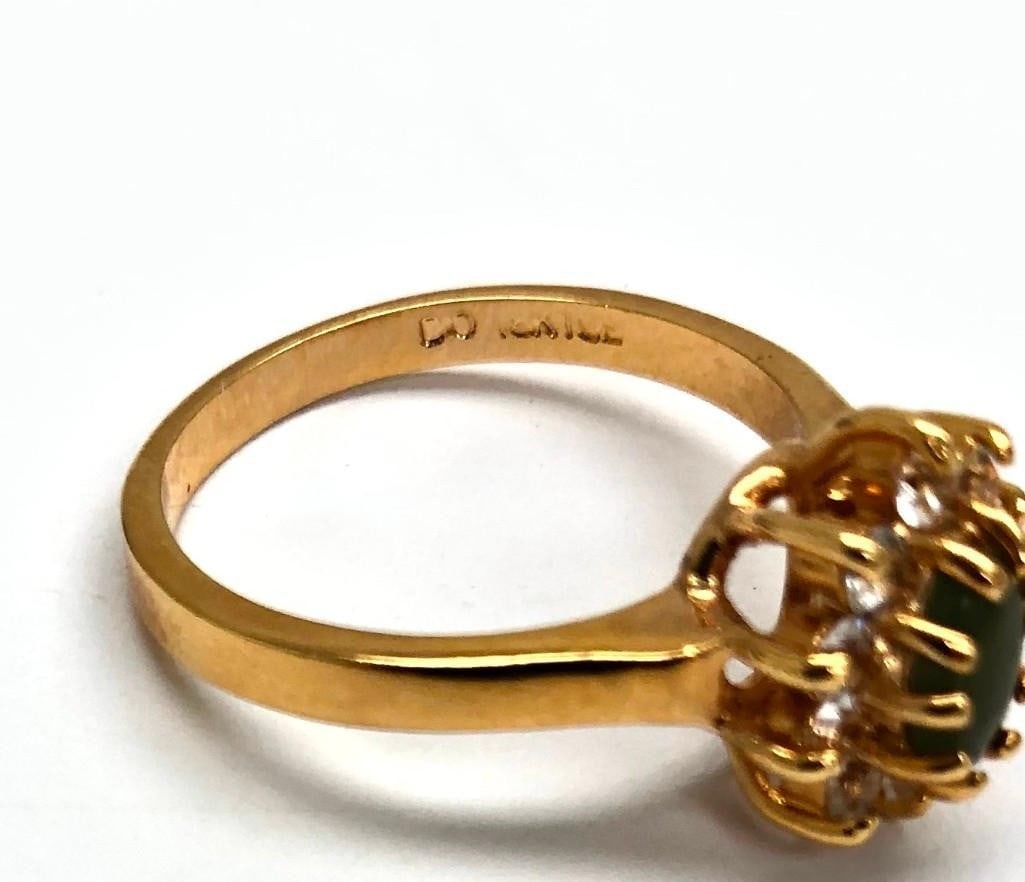 Size 7 .28ct Jade Oval Cut In 18KTGP Yellow Gold Electroplate Finish Ring: Size 7 .28ct Jade Oval Cut In 18KTGP Yellow Gold Electroplate Finish Ring. Nickel Allergy Free, Base Metal- Brass, 18KTGP Yellow Gold Electroplate Finish. Rings Have 120 Mils 18kt Gold Finish, Signed 
