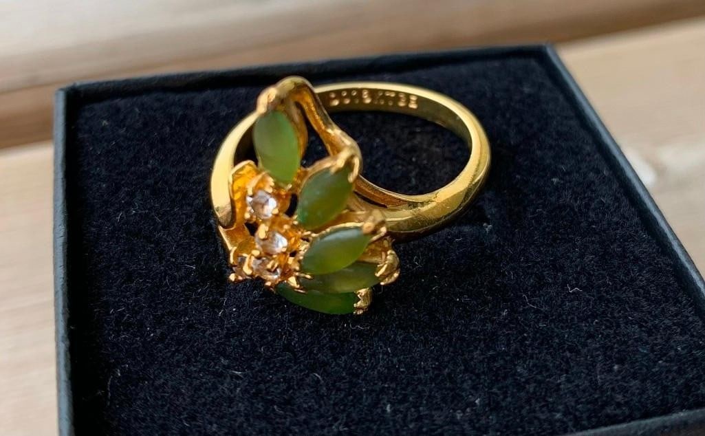 Elegant 18KTGE Ring with Marquise Cut Green Stones: Elegant 18KTGE Ring with Marquise Cut Green Stones Add a touch of bold elegance to your collection with this beautifully crafted 18kt gold electroplated ring. Featuring five angled marquise-cut green 