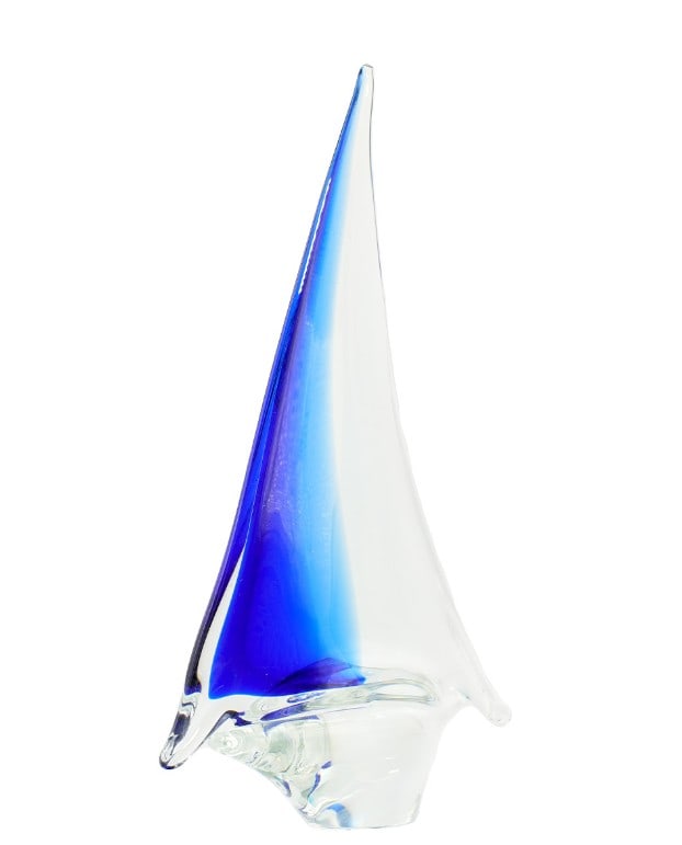 Murano Glass Sailboat Sculpture in Blue: Murano Glass Sailboat Sculpture in Blue Experience the exclusive and unique craftsmanship of our Handmade Sailing Boat Murano Glass Sculpture. Crafted with meticulous attention to detail, this exquisi