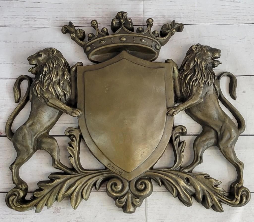 Lion & Crown Coat of Arms Family Crest Bronze Sculpture: Lion & Crown Coat of Arms Family Crest Bronze Sculpture This amazing piece that would go lovely as a family traditional crest describes the power behind a shield and two lions, they were use as a way 