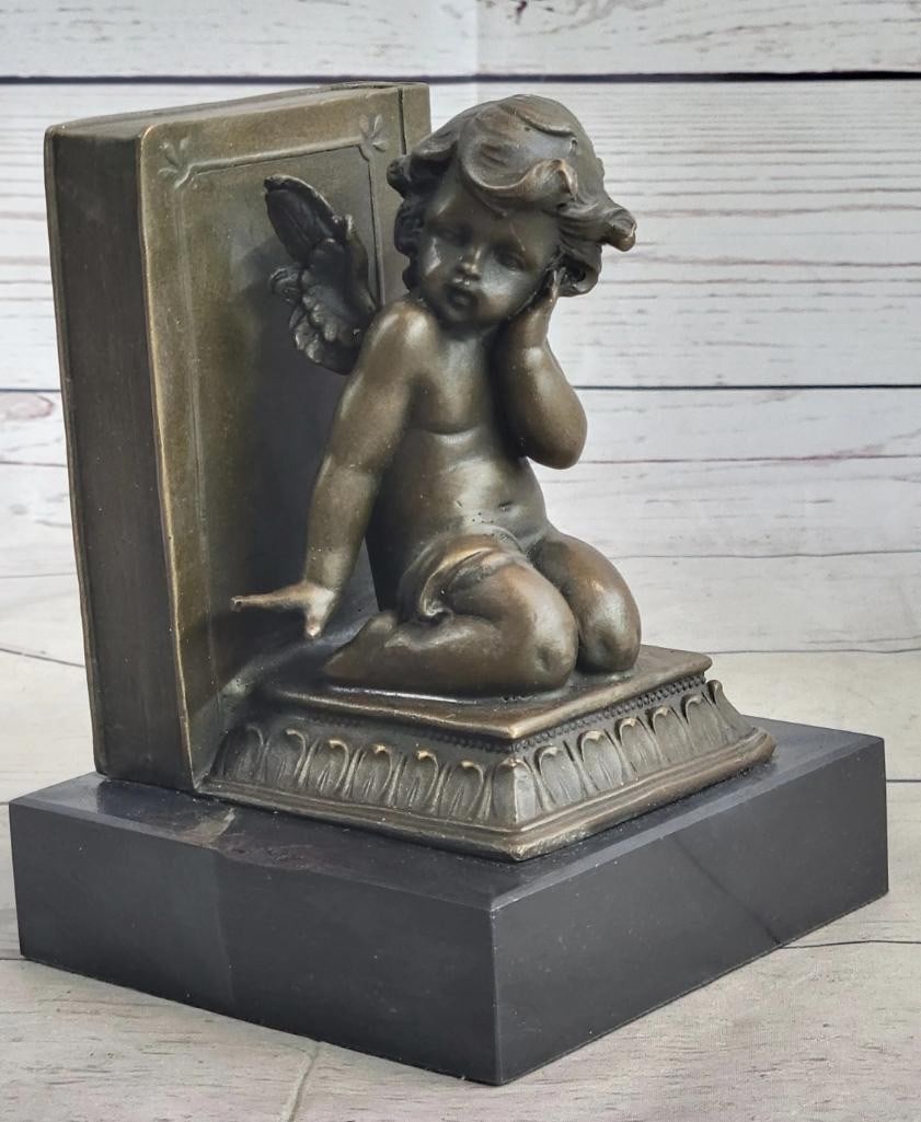 Pair of Bookends Of Bronze Cherubim On Solid Marble Base - 6'' x 4.5'': Another cute angel gift idea are these cute cherub angel bookends! I love their dark patina vintage finish! They are deep in thought sitting next to some heavy thick books! Each angel bookend is about