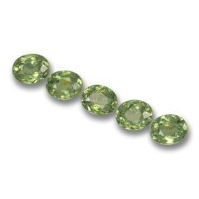 1.34ct Oval Cut Forest Green Demantoid Garnets: 1.34ct Oval Cut Forest Green Demantoid Garnets Lot Contains 5 Gemstones Total Carat Weight: 1.34ct Individual Carat Weight: Approximately 0.26ct Size: 4.3mm x 3.5mm x 2.1mm Shape: Oval Facet Clarity: