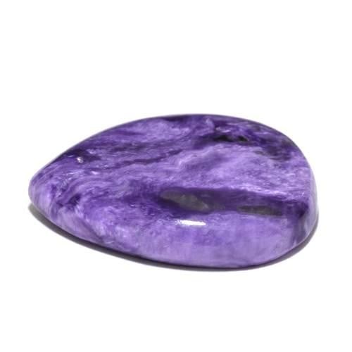 43.65 ct Pear Cut Indigo Lavender Charoite Gemstone: 43.65 ct Pear Cut Indigo Lavender Charoite Gemstone Discover the allure of " Indigo Lavender Charoite" - a mesmerizing gemstone blending deep indigo and soothing lavender hues. Crafted with