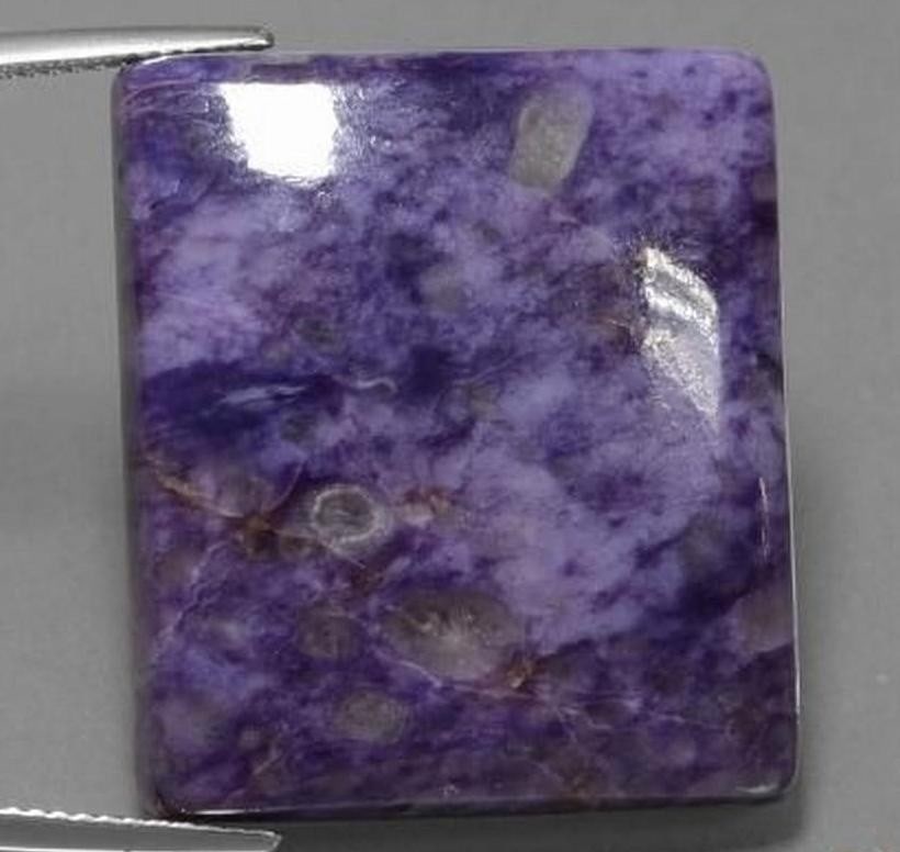 54.21 ct Natural Medium Violet Charoite, Baguette Cabochon, Opaque, Russia: 54.21 ct Natural Medium Violet Charoite, Baguette Cabochon, Opaque, Russia Natural charoite gemstone weighing 54.21 carats, cut in a baguette cabochon shape with a medium violet color. The stone