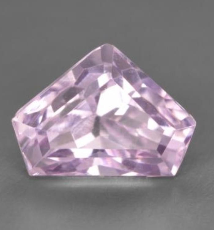 2.6ct Lilac Kunzite Gemstone: 2.6ct Lilac Kunzite Gemstone2.6ct Lilac Kunzite Gemstone Size: 9.6 x 7.1 x 6.4mm Shape: Fancy Cut Clarity: VVS Untreated Origin: Afghanistan Mohs Hardness: 7 View Photos For Further Details