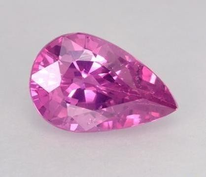 0.56 ct Pear Cut Faceted Bright Intense Pink Sapphire Gemstone: 0.56 ct Pear Cut Faceted Bright Intense Pink Sapphire Gemstone Introducing our Pear Cut Faceted Bright Intense Pink Sapphire Gemstone - a breathtaking fusion of elegance and vibrancy that commands att