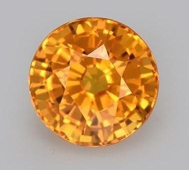 1.27 Round Facet Marigold Sky Yellow Sapphire Gemstone: 1.27 Round Facet Marigold Sky Yellow Sapphire Gemstone Introducing our radiant 1.27 ct Round Facet Marigold Sky Yellow Sapphire Gemstone-an exquisite testament to the sunlit splendor captured within