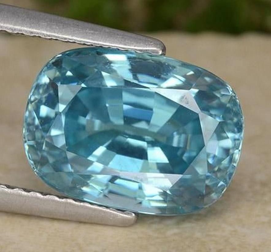 6.38 ct Natural Medium Blue Zircon, Oval Facet, VVS, Cambodia: 6.38 ct Natural Medium Blue Zircon, Oval Facet, VVS, Cambodia Natural zircon gemstone weighing 6.38 carats, cut in an oval facet shape with medium blue color. The gem measures 10.93 x 7.92 x 6.44 mm
