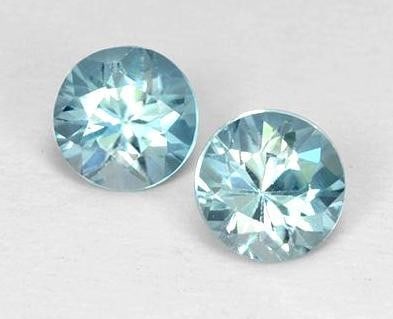 1.02ct Diamond Cut Arctic Blue Zircon Pair: 1.02ct Diamond Cut Arctic Blue Zircon Pair Size: 4.4mm Diameter x 3mm Depth Total Carat Weight: 1.02ct Individual Carat Weight: 0.51ct Shape: Diamond Cut Clarity: VVS-VS Treatment: Heated Origin: Camb